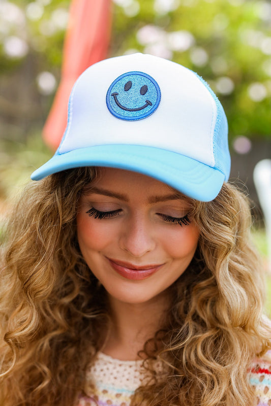 GLITTERY GRIN TRUCKER HAT