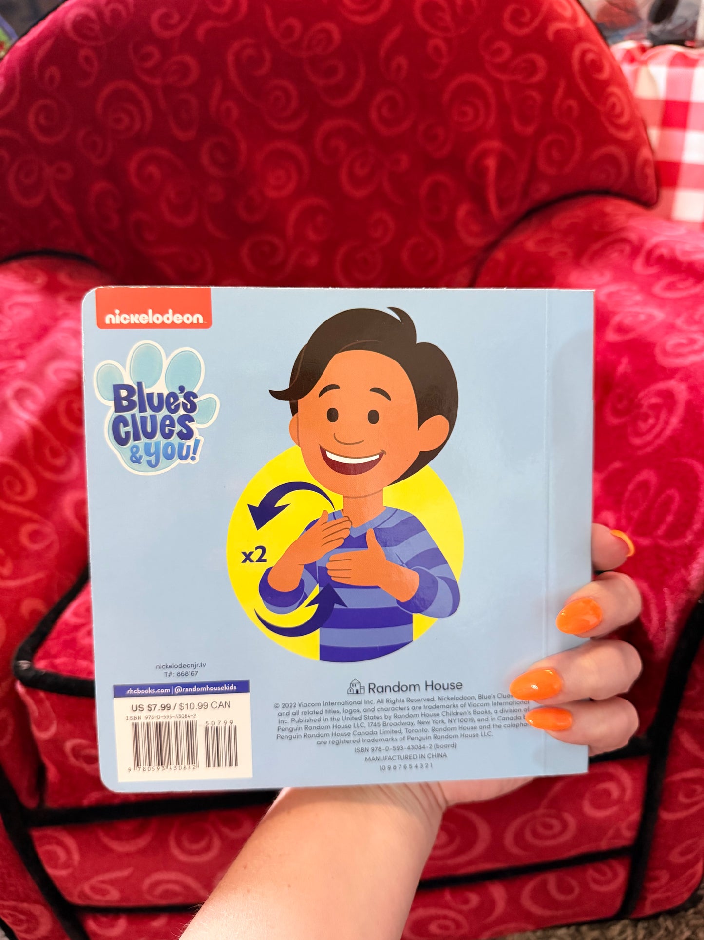 Sign with Blue book