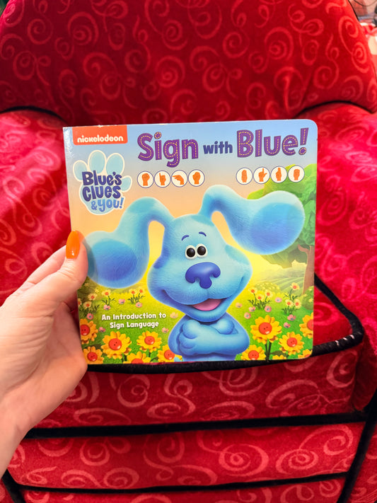 Sign with Blue book