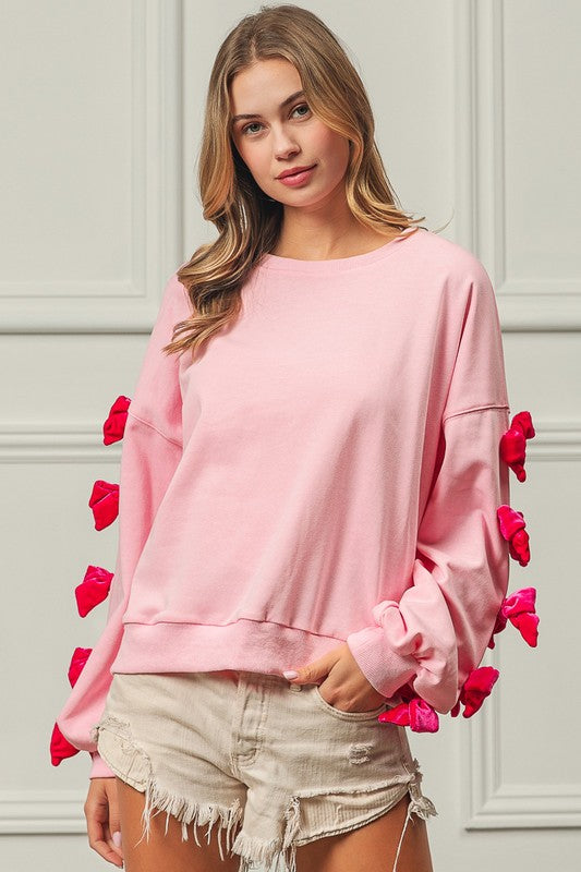 BOWS OF JOY SWEATER