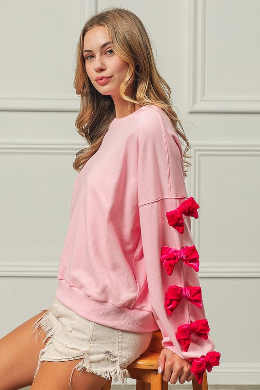 BOWS OF JOY SWEATER